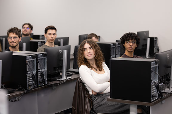 Students sit in a computer lab
