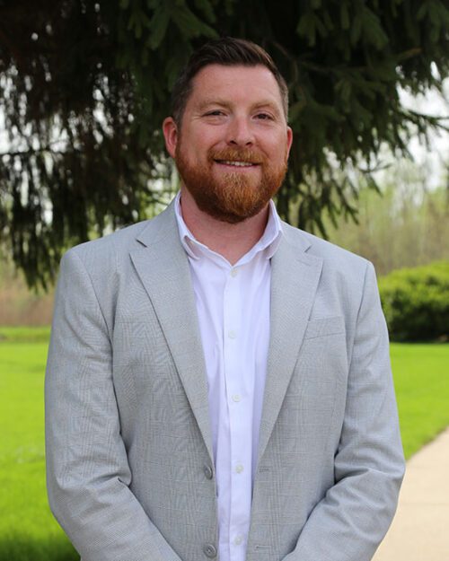 Bryan Cheek poses outdoors.