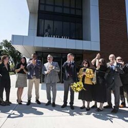 PNW's senior leadership team cuts the ribbon of Calumet Hall, officially opening the dorm.