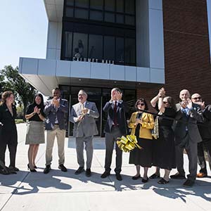 PNW's senior leadership team cuts the ribbon of Calumet Hall, officially opening the dorm.