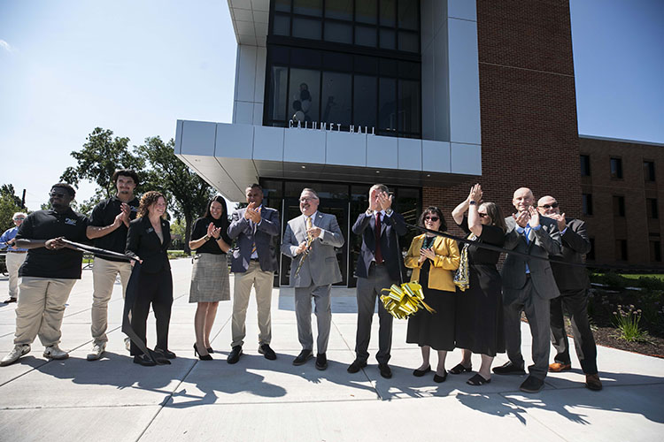 PNW's senior leadership team cuts the ribbon of Calumet Hall, officially opening the dorm.