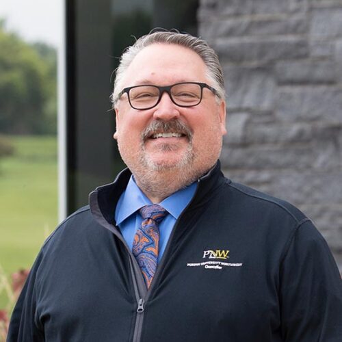PNW Chancellor Holford stands outdoors