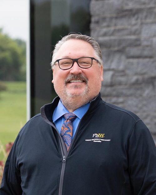 PNW Chancellor Holford stands outdoors