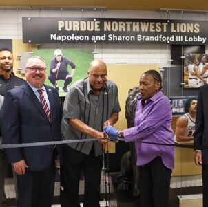 The ribbon cutting for the Napoleon and Sharon Brandford III Lobby, with Chancellor Holford standing next to the Brandfords.