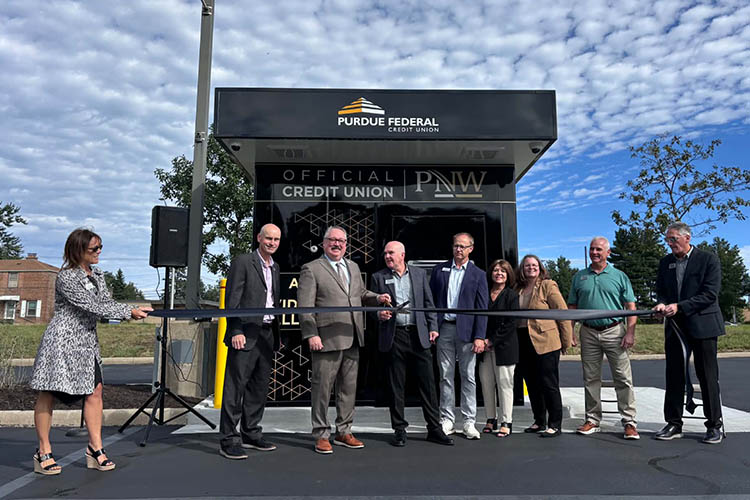 PNW and Purdue Federal leadership stand together during a ribbon cutting.