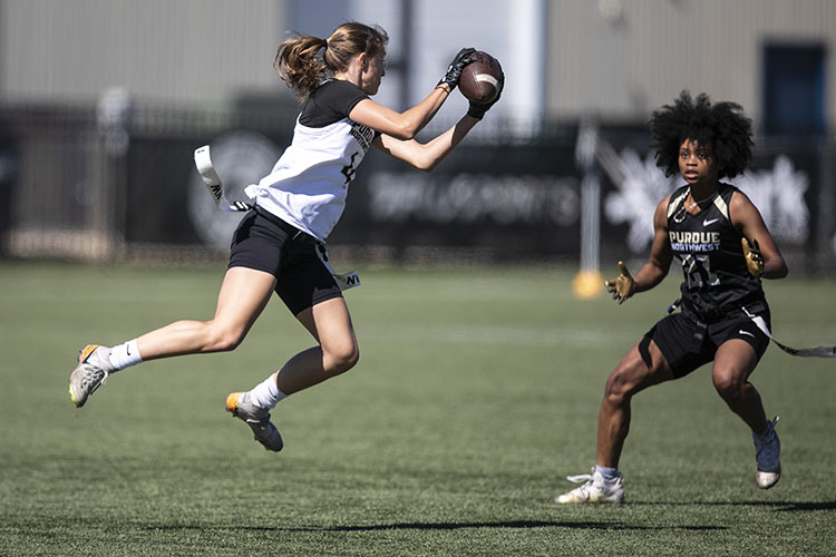 Two PNW flag football players during a scrimmage.