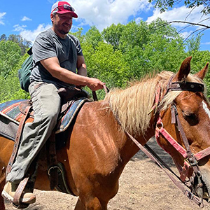 Hugo Garcia sits on a horse.