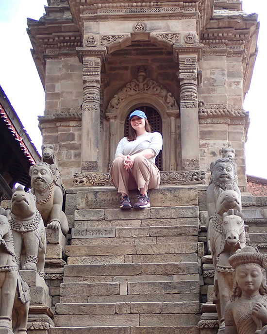 Alisha Weiler sits on a staircase