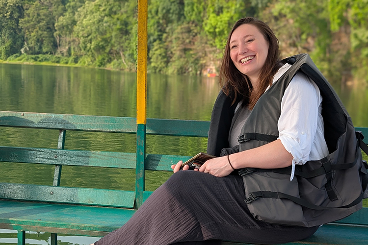 Alisha Weiler on a boat in a waterway.